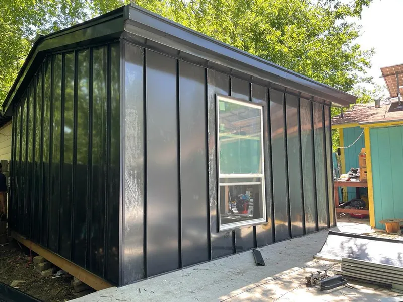 Black standing seam metal wall panels for Roof Inspection in Hermiston